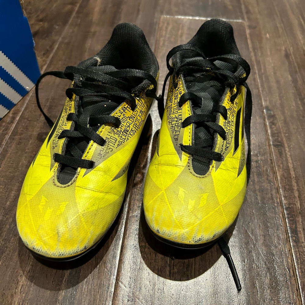 Yellow soccer cleats